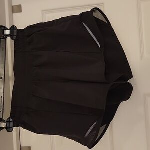 Lululemon Black Hotty Hot low rise 4" inseam size 4